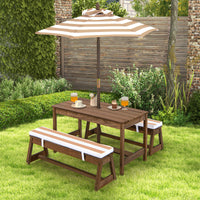 Outdoor wooden dining set with table, benches, and umbrella in a garden setting.